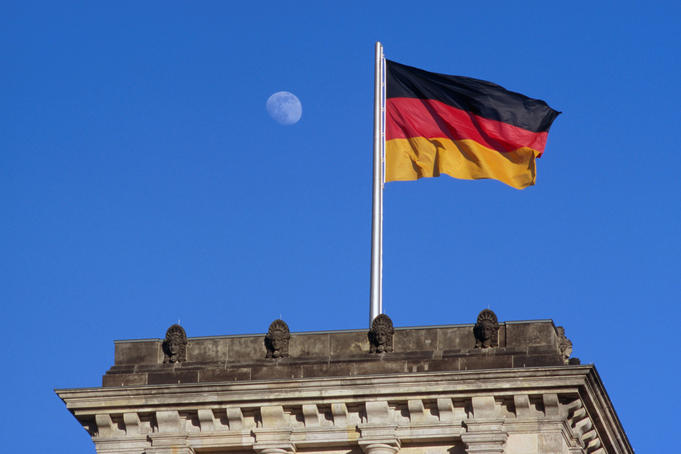 German national flag flying over Reichstag.