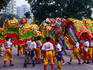 Men performing dragon dance.