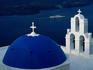Early morning view of the church on the crater's edge with one of the many boats leaving the harbour on the distance - Fira, Santorini (Thira) Island, Cyclades Islands
