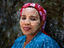 Portrait of woman with painted face.