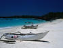 Boats on beach at Galawa Beach Resort.