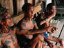 Elderly men in traditional Iban longhouse near Kuching.