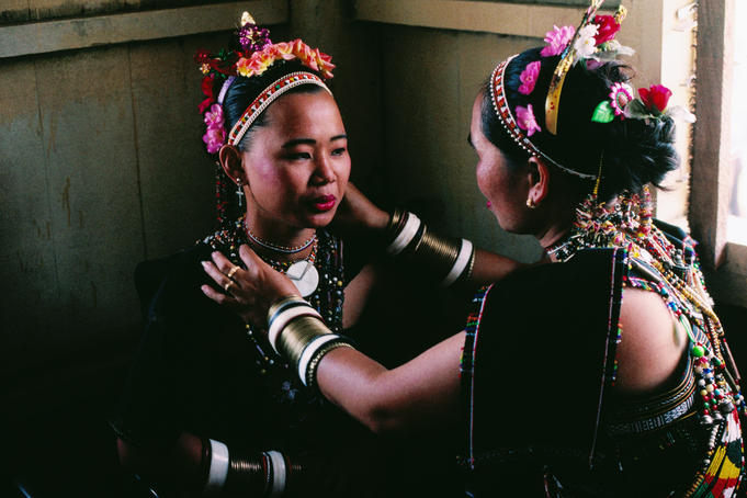Women in traditional Rice Harvet Festival costume.