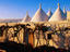 Trulli rooftops and vines.