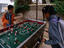 Children playing table soccer.