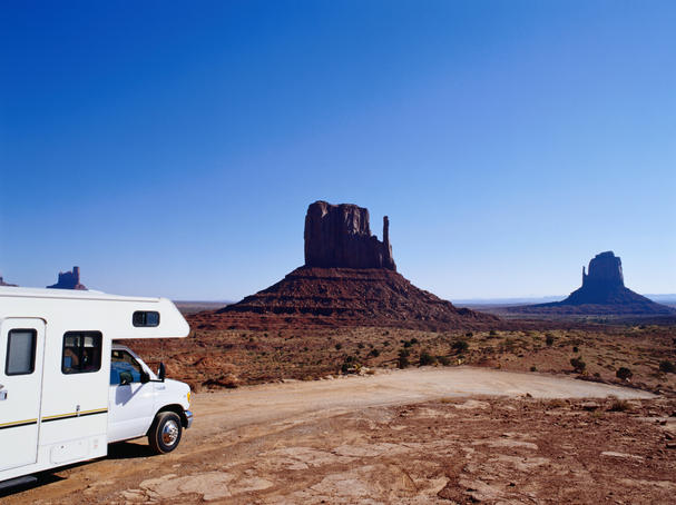 RV (campervan) in front of mittens and mesas.