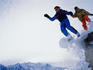 Two skiers jumping off ledge, Brevent.