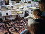 Family overlooking leather vats.