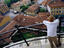 Tourist looking down from Leaning Tower.
