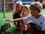 Boy patting an owl at the Spier Wildlife Shelter.