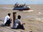 Pier watching ferry, The Guianas