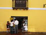 People shopping at a small store in the Old Quarter.