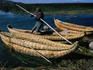 Local fisherman with totoro reed boat on Lake Titicaca