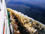 Ferry on Rio Negro with black water in wake.