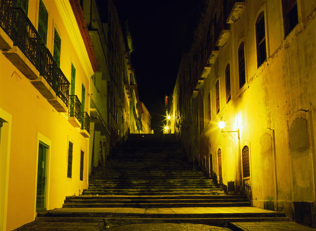 Stairway between Colonial-era houses lit up at night São Luis