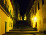 Stairway between Colonial-era houses lit up at night São Luis