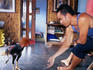 Man training his young fighting cock, Jogjakarta.