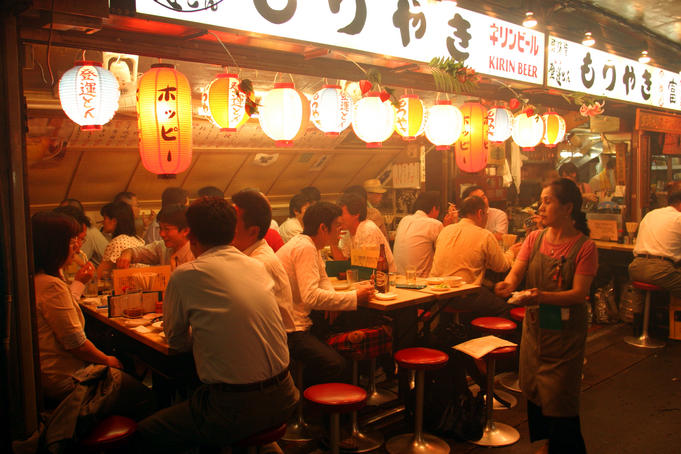People enjoying Friday night at Ton Ton Yakitori bar, Ginza.