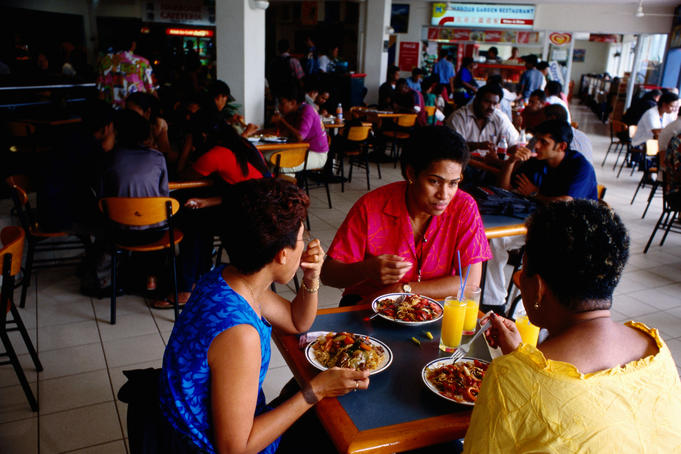 People eating in Harbour centre food court.