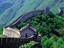 Lush green foliage surround Great Wall of China.