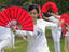 Women dancing with fans, Singapore