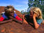 Children talking on a  rock in the Western Desert.