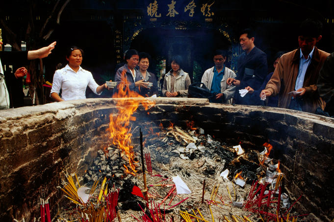 Devotees burning incense at Yuantong Temple.