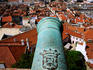 Overhead of city with cannon of Castelo de Sao Jorge in foreground.