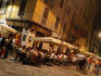 People at outdoor tables of Bar Brera in Brera district at night.