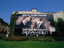 Armani advertisement on house wall in front of Armani-sponsored lawn, Via Mercato.