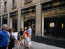 Shoppers walking past Dolce & Gabbana, Via della Spiga.