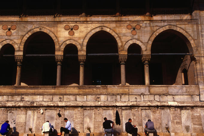 Men washing outside Yeni Cami Mosque.