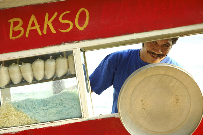 Portrait of man working in mobile food stall.