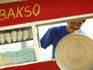 Portrait of man working in mobile food stall.