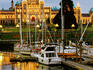 Boats on Victoria harbour with Parliament House in background.
