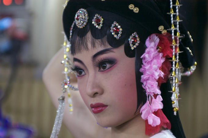 Chinese opera performer preparing for show at Sheng Hong Temple.