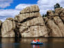 People paddle-boating on Sylvan Lake, Custer State Park.