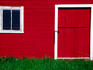 Door and window in red barn near Deadwood.