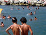 Boys preparing to dive at beach at Chiaia.