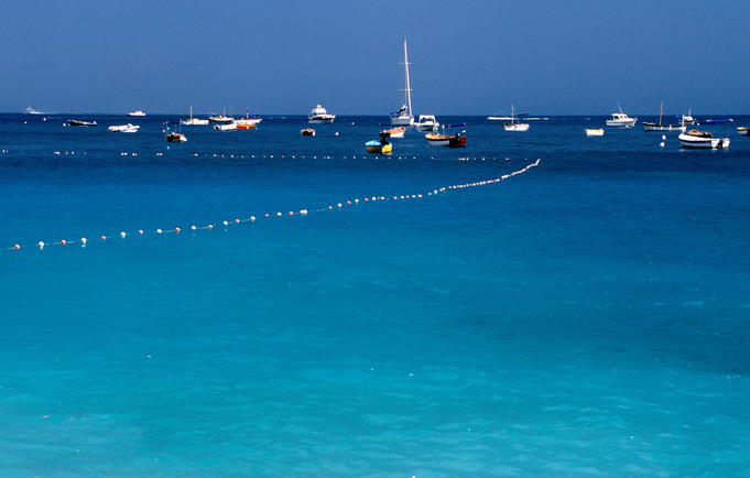 Boats moored at Spiaggia del Fomillo.