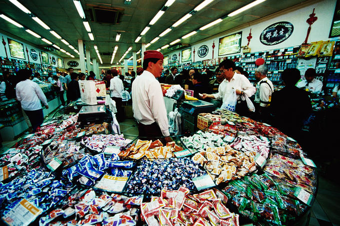 People in confectionary shop on pedestrian mall of Nanjing Donglu.