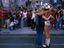 Naked Cowboy performing for tourists in Times Square.