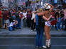 Naked Cowboy performing for tourists in Times Square.