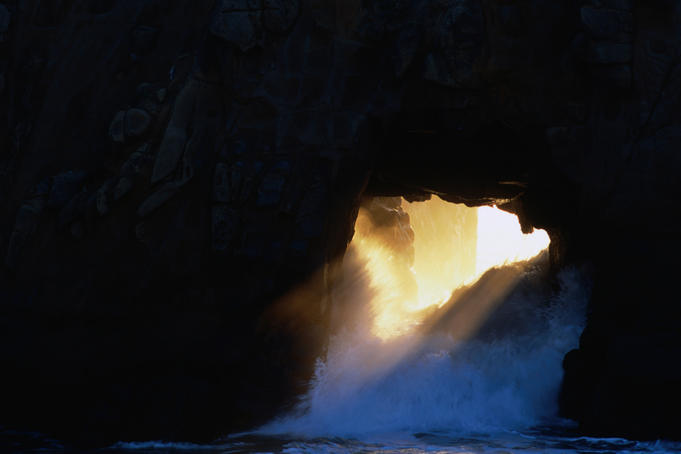 Wave crashing through rock, Pfeiffer Beach, Big Sur.
