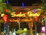 Surfers Paradise neon sign over road.