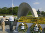 Couple honoring the victims of the atomic bombing at the Peace Memorial Park.