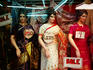 Mannequins in saris in shop window.