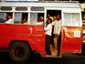 Passengers on crowded bus.