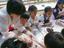 Children making Tteok during Traditional Korean Food Festival.