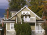House with ivy on Commercial Drive.